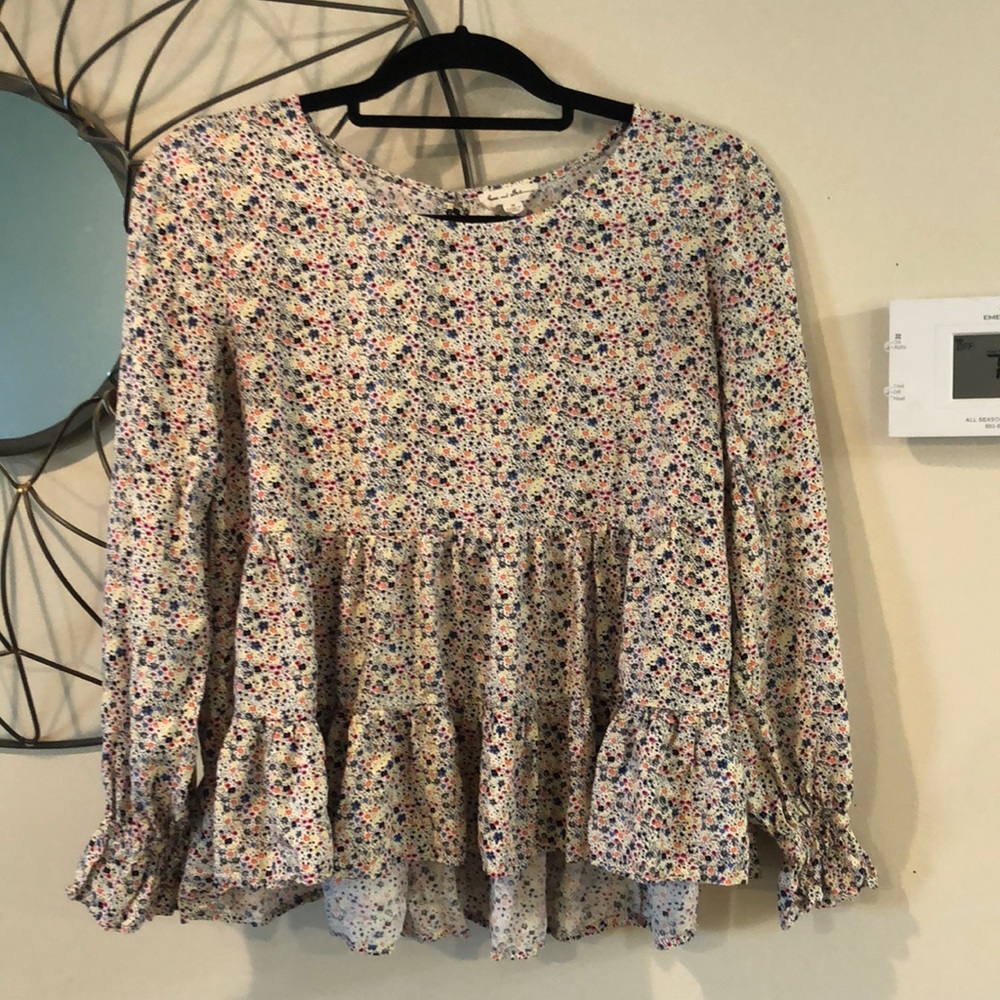 Long-sleeve floral peplum top. Like new.